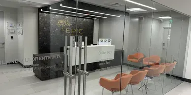 Modern medical office reception area with seating.