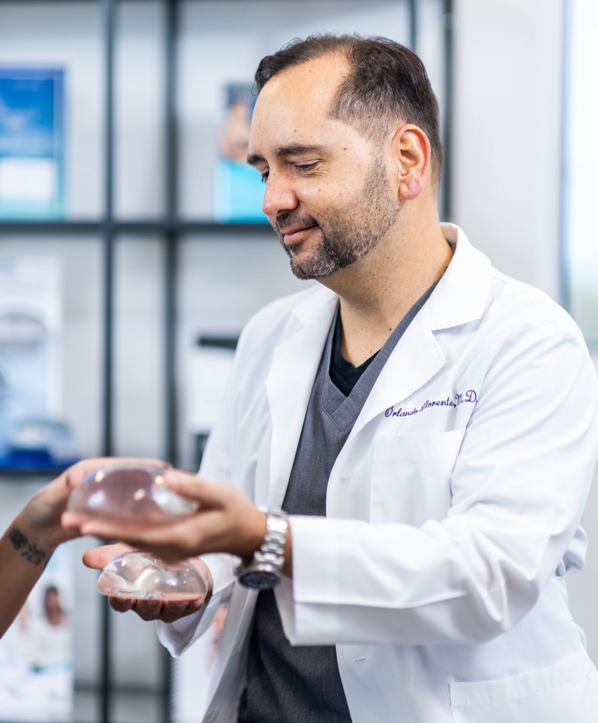 Doctor discussing silicone breast implants with patient.