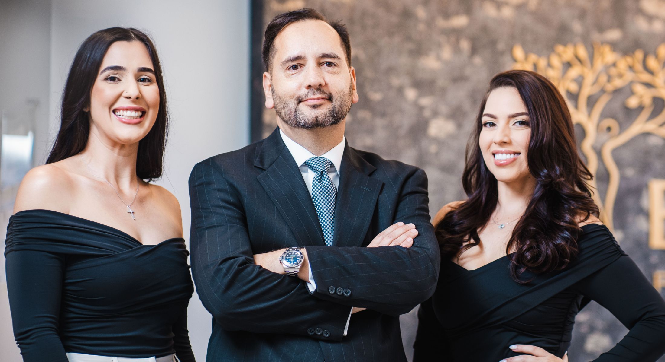 Business team portrait with individuals in formal attire.